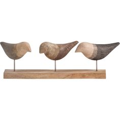 three wooden birds sitting on top of each other