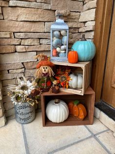 some pumpkins and gourds are sitting on shelves outside the front door,