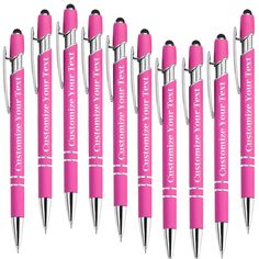 six pink pens with white writing on them