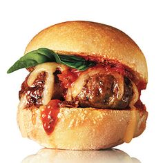 a meatball sandwich with tomato sauce and mushrooms