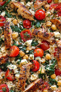 chicken and rice salad with tomatoes, chickpeas, and spinach