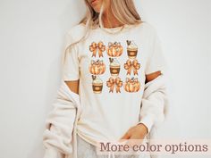 Embrace the cozy vibes of autumn with our retro fall pumpkin spice shirt. Featuring a charming bow-adorned pumpkin design, this shirt perfectly captures the essence of the season. Ideal for pumpkin spice lovers and bow aesthetic enthusiasts, it makes a delightful gift for the fall season. SHIRT DETAILS: -  Made from very soft materials  - 100% cotton for solid colors  - Heather colors and sports grey include polyester  - The shoulders have twill tape for improved durability.  - There are no side Cute Fall T-shirt For Gift, Fall Season T-shirt Gift, Fall Gift T-shirt With Short Sleeves, Casual Halloween Tops For Gifts, Fall Short Sleeve Tops For Gifts, Short Sleeve T-shirt For Fall Gift, Fall Short Sleeve Tops For Gift, Short Sleeve Tops For Fall Gift, Cute Orange Fall Tops