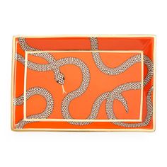 an orange tray with snake design on it