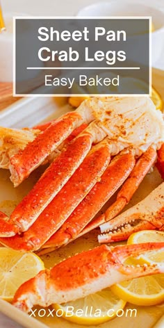 a plate with cooked lobsters and lemon wedges on it, text overlay reads sheet pan crab legs easy baked