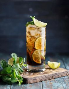 two glasses filled with iced tea and limes