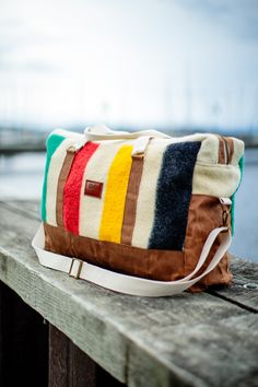 Whether you're planning a cross-country road trip, jet-setting across the globe, or packing for a little getaway, the Weekender Duffle is for the adventurer who likes to travel in style. It is made from sustainable and vintage materials and carefully crafted to stand the test of time. Weekender Duffel Dimensions: Body: 24" Long x 16" Tall x 8" Wide. Straps: 25" Handles, 65" Shoulder Strap (at longest setting). Features: 12 oz. Waxed Canvas Reinforced Canvas & 100% Cotton Webbed Handles Removable Blanket Colors, Cross Country Road Trip, Hudson Bay, Antique Brass Hardware, Travel In Style, Waxed Canvas, Country Road, Vintage Textiles, Cross Country