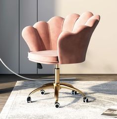 a pink office chair sitting on top of a rug