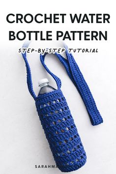 the crochet water bottle cover is made with blue yarn and has a strap around it