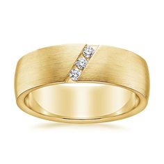 a yellow gold wedding ring with two diamonds