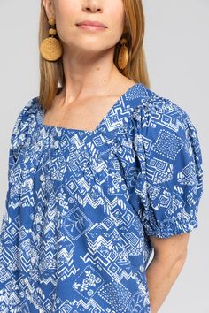 We wanted a casual dress that you could throw on and run out the door. Our Everett dress is the dress you can do anything in. Whether you are running errands, playing with kids, or on a beach trip, this dress is perfect for your everyday. It was designed with a loose oversized fit. We love wearing it as a beach cover up too! Details Geometric paisley print Button placket up the length of the dress Mini Length Pockets Cotton fabric Fit Notes Jacklene takes an XS in this style. Dress is made with Square Neck Cotton Sundress For Vacation, Blue Square Neck Maxi Dress For The Beach, Blue Square Neck Midi Dress For The Beach, Blue Square Neck Maxi Dress For Beach, Blue Square Neck Midi Dress For Beach, Cotton Beachy Dress For Summer Outings, Cotton Beachy Dresses For Summer, Cotton Square Neck Maxi Dress For Vacation, Beachy Blue Short Sleeve Dress