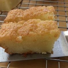 two pieces of cake sitting on top of a cooling rack