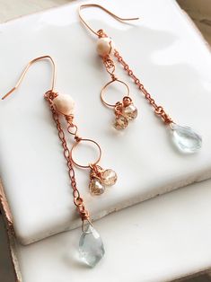 This pair of rose gold tone long dangle earrings are made with beautiful clear light blue fluorite fancy shape briolettes. They are pretty and perfect to wear for holidays, or make as a gift for Valentine's Day or birthday! Get yourself these earrings for most occasions, whether for wearing to work, date or all kinds of parties.  They could add a touch of elegance on you. Shipping & returns  FREE SHIPPING in the US   Ready to ship in 3-5 business days. Returns and exchanges: Please contact me fi Rose Gold Dangle Chandelier Earrings, Rose Gold Dangle Linear Earrings As Gift, Rose Gold Teardrop Chandelier Earrings Gift, Rose Gold Wire Wrapped Dangle Jewelry, Rose Gold Wire Wrapped Dangle Earrings, Rose Gold Copper Dangle Earrings, Boho Drop Earrings, Blue Fluorite, Long Dangle Earrings