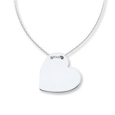 Simply captivating, this contemporary necklace for her features a heart of 14K white gold, threaded through the top with an adjustable 16- to 18-inch cable chain. The necklace secures with a lobster clasp. Modern Heart Charm Necklace As Gift, Modern Heart Charm Necklace Gift, Modern Necklaces For Anniversary On Valentine's Day, Modern Necklaces For Valentine's Day Anniversary, Modern Heart Charm Necklace For Valentine's Day, Modern Heart Pendant Necklaces For Valentine's Day, White Gold Heart Pendant Necklace With Cable Chain, Modern Sterling Silver Heart Pendant Necklace, Sterling Silver Heart Necklace With Cable Chain