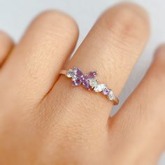 It's never too late to reinvent yourself and start a wonderful new beginning. Unfold your wings and emerge like a butterfly with our Monarch Butterfly Amethyst Opal Ring. This dainty charm features a purple butterfly-shaped amethyst adorned with Ethiopian opal and white topaz gemstones that sit delicately in a white gold tone band. Vibrant and full of life, wear this charm as you celebrate and embrace your own incredible beauty. ✦ Available in both 14K white gold vermeil (14K white gold plated o Butterfly Engagement Rings, Purple Opal Ring, Italian Minimalism, Cluster Wedding Band, Butterfly Engagement Ring, Engagement Ring Marquise, Flower Engagement, Amethyst Wedding, Ring Marquise