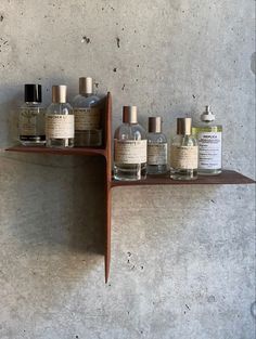 a shelf with several bottles on top of it