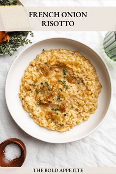 a white bowl filled with risotto on top of a table