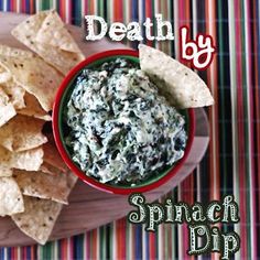 a bowl of spinach dip with tortilla chips