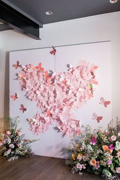 there are flowers and butterflies on the wall