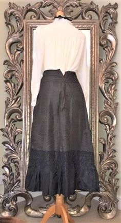 Authentic Victorian Silk Walking Skirt. Lined Black Full Length Skirt with Ruffle/Frill Detail around the Hem.Fastens with Press Studs. Waist is small , as expected but could be made bigger by adding an etra flap at the opening, or adding Tie fastening if so desired.There is some damage to the Silk, and some damage on the inside,( not surprising considering it's age) but the Piece is still sturdy and Wearable.Would make a Fab  Goth/Steampunk/Witches or Vampire Halloween/Black Widow /Victorian Gh Black Steampunk Bottoms For Costume Party, Steampunk Black Bottoms For Costume Party, Gothic Flared Skirt Bottoms For Party, Gothic Ruffled Skirt, Gothic Flared Lined Skirt, Gothic Fitted Skirted Bottoms, Steampunk Style Fitted Skirt, Black Steampunk Skirt For Party, Fitted Steampunk Skirt