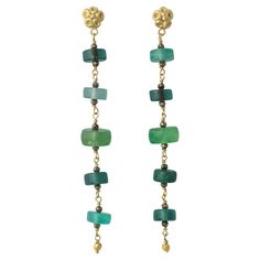 A lovely set of earrings with clear tourmaline gemstones in vivid tonal greens. The gemstones were obtained from a retiring cutter, and comes from an old lot of tourmalines which was cut in the last century. Nowadays, green tourmalines in gemstone quality like this would never be cut into beads as they have become very expensive and it would produce too much waste. The unusual disk cut, though, makes it a captivating and modern piece with lots of movement with little black pyrite beads added for Tourmaline Gemstone, Modern Earrings, Gold Drop Earrings, Green Tourmaline, Ear Jewelry, Modern Jewelry, Tourmaline, 18k Gold, Fine Jewelry