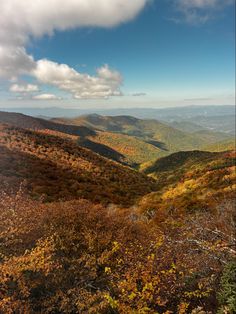 the mountains are covered in autumn foliage