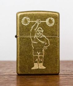 a lighter with a drawing of a man playing golf