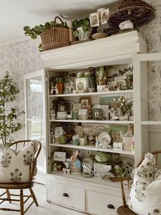 a white bookcase filled with lots of books