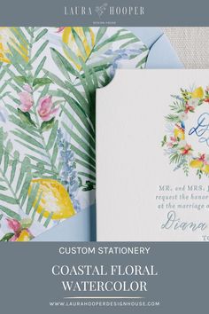 wedding stationery with watercolor flowers and greenery on the front, blue envelope