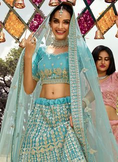 Aqua Blue Gotta Patti Embroidered Wedding Lehenga Choli is a best pick as an indian wear for festival or wedding events. This elegant set has a very pretty traditional embroidery detailed with gota patti, zari, zarkan and dori work on organza silk lehenga with satin lining paired with equally embellished organza choli and ethnic embroidered soft net dupatta. Team this beautiful attire with classic pair of heels and golden jewellery to look like a diva. This set comprises of a designer choli top, Organza Silk Lehenga, Designer Choli, Golden Jewellery, Wedding Lehenga Choli, Dori Work, Lehenga Choli For Women, Choli For Women, Gotta Patti, Traditional Embroidery