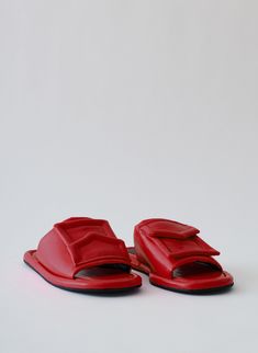 This season, we are extending our Beryen Naplack Slide assortment and bringing back the fan favorite colorways--Black and Red. Handcrafted in Brazil, this crinkled patent leather slide features a functional oversized pocket detail with a fuss-free slip on feature. Easily paired back with the WOFs to HTH’s already in your wardrobe, or back to any novelty pieces in our Spring Collection, this is your footwear hero of the season. 100% Leather (Upper, Inner) 100% Rubber (Sole) Style Number: SS23BE52 Leather Slides, Spring Collection, Pocket Detail, Fashion Advice, Patent Leather, Black Red, Brazil, Rubber Sole, Leather Upper