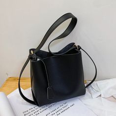 SPECIFICATIONSWeight: 500gTypes of bags: Shoulder & HandbagsStyle: CasualSize: 21x20x11cmShape: BucketPattern Type: panelledOrigin: Mainland ChinaOccasion: VersatileNumber of Handles/Straps: TwoModel Number: SacMain Material: PULining Material: PolyesterItem Type: HandbagsInterior: Interior Slot Pocket,Interior Zipper PocketHardness: SOFTHandbags Type: Shoulder BagsGender: WOMENColor: Black White KhakiClosure Type: HaspBrand Name: BINGYUEXIANG Black Box Bag With Single Shoulder Strap For Everyday, Black Rectangular Satchel With Single Shoulder Strap, Black Square Satchel With Single Shoulder Strap, Black Square Bag With Single Shoulder Strap, Black Office Satchel With Single Shoulder Strap, Black Hobo Bag With Phone Bag For Office, Black Bucket Bag With Single Shoulder Strap, Black Faux Leather Shoulder Bag With Single Strap, Elegant Black Rectangular Bucket Bag