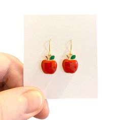 Apple Earrings, Fruit Earrings, Fun Earrings, Red Apple Earrings, Quirky Earrings, Weird Earrings, Aesthetic Earrings, Novelty Earrings These playful and cute Apple Earrings are really adorable, they will look great with a lovely dress or jeans and t shirt. Handmade gold plated ear wires with gorgeous red Apple enamelled charms and green enamelled leaves on gold plating. Perfect earrings for gifts or as a treat for yourself. 🍄 SIZE :approximately 3.5 cm drop. 🍄 MATERIALS: gold plated Apple charm, gold plated wire, green enamel.  🍄 DESPATCH TIME: Posted next working day. 🍄Your Bonnie Wishes Jewellery will come wrapped in tissue paper with a lovely sticker and will be posted in a strong postal box to ensure your order reaches you in perfect condition. 🍄 I only use premium quality jewell Weird Earrings Aesthetic, Earrings Weird, Weird Earrings, Apple Earrings, Aesthetic Earrings, Novelty Earrings, Quirky Earrings, Earrings Aesthetic, Fruit Earrings