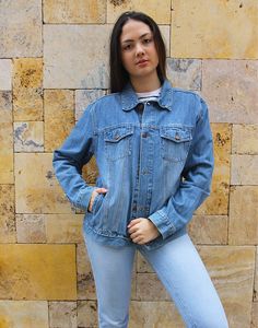 Vintage blue jean jacket in a mid wash denim. Boyfriend style. Two chest pockets. Size medium, UK 10-14 / EU 38-42. Measurements - 40"(102cm) bust - 26"(66cm) sleeve length - 25" (64cm) jacket length. Material - Denim. Condition - Good, wear to arm as shown . Handpicked, repaired and ready to wear. This is an original vintage item, not new and minor signs of wear & age are expected, we will highlight any major flaws. Model is a UK 6/8 and is 5'7" tall Relaxed Fit Denim Jacket In Recycled Denim, Washed Blue Denim Jacket With Pockets, Light Wash Relaxed Fit Denim Jacket In Recycled Denim, Light Wash Relaxed Fit Recycled Denim Jacket, Relaxed Fit Light Wash Recycled Denim Jacket, Relaxed Fit Medium Wash Recycled Denim Jacket, Casual Denim Blue Recycled Denim Jacket, Casual Dark Wash Recycled Denim Jacket, Casual Denim Blue Jacket From Recycled Denim