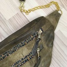 a purse with a chain attached to it