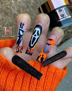 These long coffin-shaped nails are a tribute to the horror classic 'Scream,' featuring the iconic ghost face, flames, and eerie graveyard scenes. The fiery orange and black tones create a dramatic, intense look that’s perfect for horror enthusiasts. The textured black accent nails add a unique contrast, making this design both spooky and stylish.@honeysnailsecret Black Accent Nails, Square Halloween Nails, Ivory Nails, Fun Halloween Nails, Horror Nails, Orange Nail Designs, Halloween Acrylic Nails, Swarovski Nails, Colored Acrylic Nails