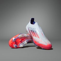 a pair of soccer shoes on a gray background