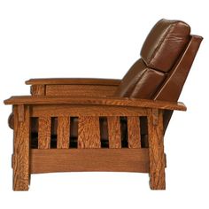 a wooden recliner chair sitting on top of a white background