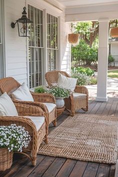 some wicker chairs sitting on a porch