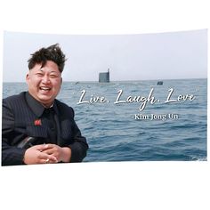 an image of a man smiling in front of the ocean with a quote from kim yong un