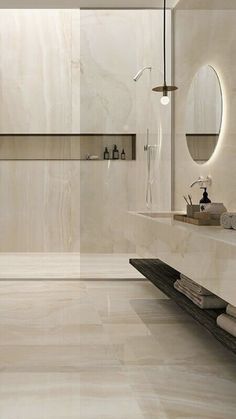 a modern bathroom with marble floors and walls