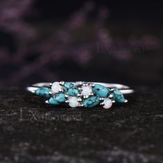 Item description ✦ Handmade, high-quality item! ✦ Material: 925 sterling silver, Solid 10k/14K/18K GOLD (can be made in white/rose/yellow gold) Wedding band ✦ Gemstones: 2x4mm Marquise Cut Natural Turquoise and 2mm Round Cut Lab Opal Any ring size can be made,if the ring size is not in the option list ,contact me. As it is handmade,it needs 2-4 weeks to finish and then be shipped by usps or DHL. Return policy: We offer 30 days return policy. For any reason, if you are not completely satisfied with your order, you may return it for a refund. Buyer is responsible for the handcraft fee (15%-30% of the total price) and the return shipping cost. Turquoise Multi-stone Round Opal Ring, Multi-stone Turquoise Ring For Anniversary, Fine Jewelry Multi-stone Turquoise Ring For Anniversary, Silver Turquoise Ring For Wedding, Turquoise Rings With Gemstone Accents For Anniversary, Gift Turquoise Cluster Ring With Gemstone, Elegant Turquoise Opal Ring For Anniversary, Turquoise Opal Ring For Anniversary, Fine Jewelry Style, Fine Jewelry Turquoise Opal Ring For Anniversary