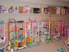 a room filled with lots of toy cars and shelves full of toys on top of them