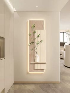 a white vase with a plant in it on a wall next to a counter top