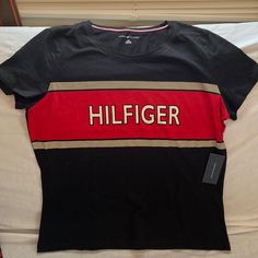 Large Woman Tommy Hilfiger T-Shirt Red, Bage And Black, With Front Logo Casual Red Tommy Hilfiger T-shirt, Tommy Hilfiger Black Crew Neck T-shirt, Tommy Hilfiger Black Crew Neck Top, Tommy Hilfiger Sporty Black Tops, Trendy Tommy Hilfiger Tops With Graphic Print, Tommy Hilfiger Red Crew Neck Top, Trendy Red Tommy Hilfiger Top, Tommy Shirt, Tommy Hilfiger Baby