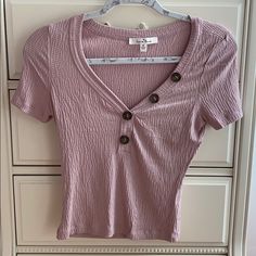 This Top Is So Trendy And Has A Cute Button Detail! It Is A V Neck Design Top And Is Super Stretchy And Comfortable. It Is Brand New And Has Never Been Worn! Cute Pink V-neck Top, Pink Crew Neck Top With Button Closure, Spring V-neck T-shirt With Button Closure, Trendy Pink Button-up Top, Casual Pink Top With Button Closure, Cute Pink Button-up Tops, Trendy Pink Buttoned Tops, Trendy Pink Tops With Buttons, Pink Cotton Buttoned Top