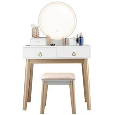 a white vanity table with a mirror and stool next to it on a white background