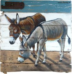 two donkeys painted on wooden planks in front of a wall