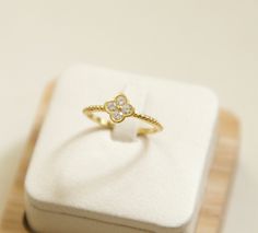 Introducing our CZ Diamond Clover Ring, a stunning piece crafted in gold vermeil, perfect for those seeking a touch of elegance. The intricate design features a charming clover band ring made from high-quality sterling silver 925, exuding both sophistication and style. This four leaf clover ring makes a delightful choice for engagements, anniversaries, or as a promise ring. Adorned with sparkling CZ diamonds, it adds a touch of glamour to any outfit. Embrace luck and beauty all in one with this exquisite clover ring - a true symbol of love and good fortune. size : 6 and 7 material:sterling silver 925, gold vermeil and CZ cubic zirconia comes with a gift box. View more jewelry HERE:  https://www.etsy.com/shop/DearMia?ref=listing-shop2-all-items-count#items Luxury Tarnish-resistant Diamond Ring As Gift, Luxury Yellow Gold Diamond Ring For Gift, Luxury Yellow Gold Diamond Ring As Gift, Cubic Zirconia Diamond Ring Gift, Cubic Zirconia Diamond Ring, Tarnish Resistant, Gift, Yellow Gold Diamond Ring As Gift, White Gold-plated Diamond Ring Gift, Gift Yellow Gold Diamond Ring Tarnish Resistant, Gold-plated Diamond Cut Ring As Gift