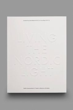 a white book with the words living in nordic light written on it's cover