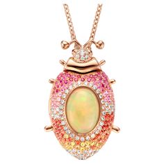 One of a kind lucky beetle necklace in 18 Karat rose gold 26,2g set with the finest diamonds in brilliant cut 0,62Ct (VVS/DEF quality) one natural, opal in oval cabochon cut 5.00Ct, pink and orange, yellow and pink sapphires in brilliant cut 1,45Ct. The feelers and the eyes are set with tsavorites and pink tourmalines in round cabochon cut. The chain is 60 cm long, including an extra eye to make it 5 cm shorter. This lucky beetle is a locket, you can keep your favorite picture inside. Celine Roelens, a goldsmith and gemologist as well, is specialized in unique, fine jewelry, handmade in Belgium and brought to life by experienced craftsmen. Original pieces made from precious materials of exceptional quality. Celine launched "The Goldbeetle” in 2020. The brand name is inspired by the rare an Multi Gem Ring, Beetle Necklace, Yellow Pendant, Sapphire Diamond Pendant, Antique Necklaces, Pink Spinel, Orange Sapphire, Favorite Picture, Antique Necklace